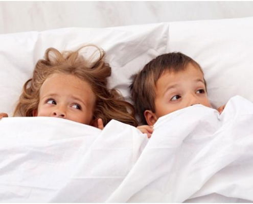 Kids in bed afraid because they do not know how to get rid of lice