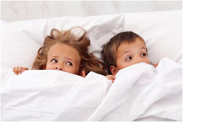 Kids in bed afraid because they do not know how to get rid of lice